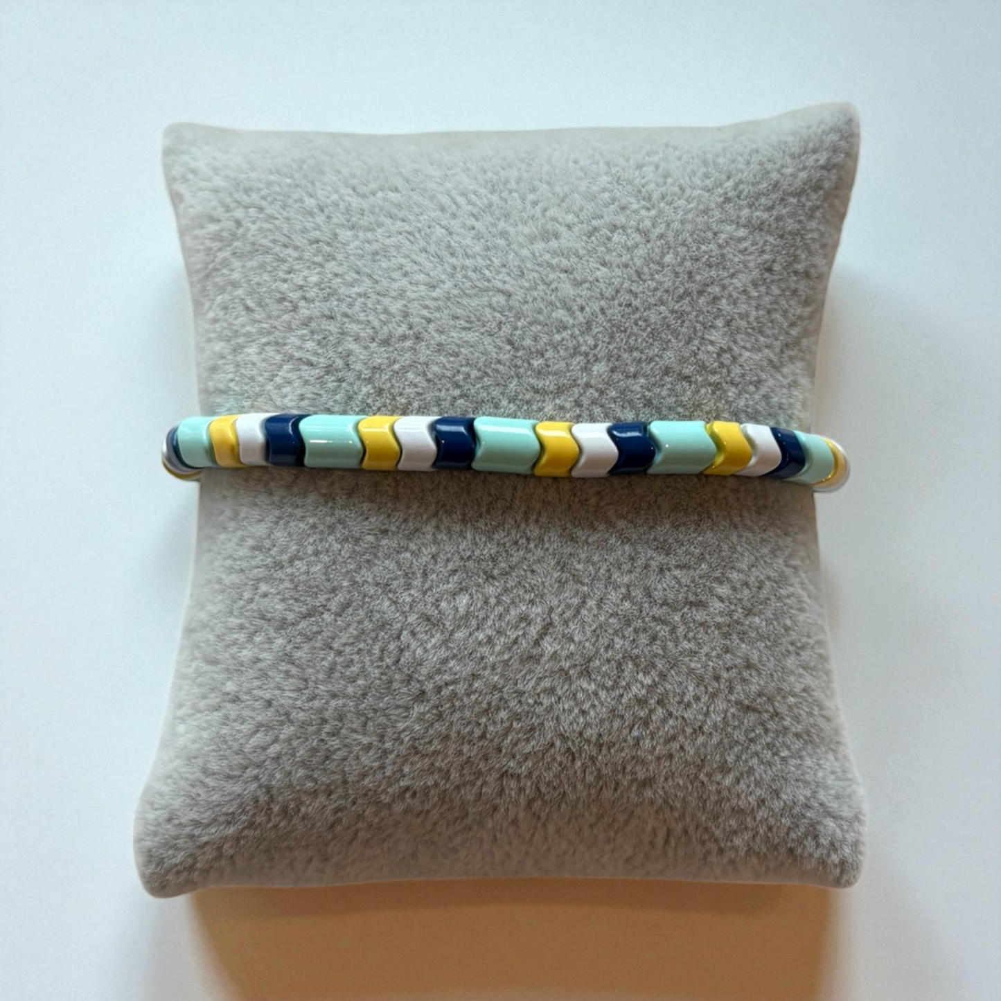 Blue, Green, White, and Yellow Wavy Spacer Bead Bracelet